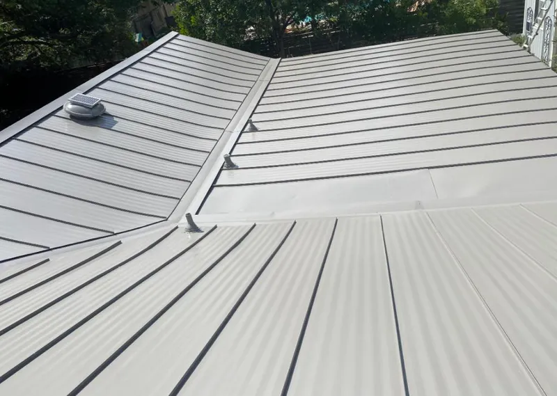Solar attic fan installed on a metal roof for Roof Ventilation in Castro Valley