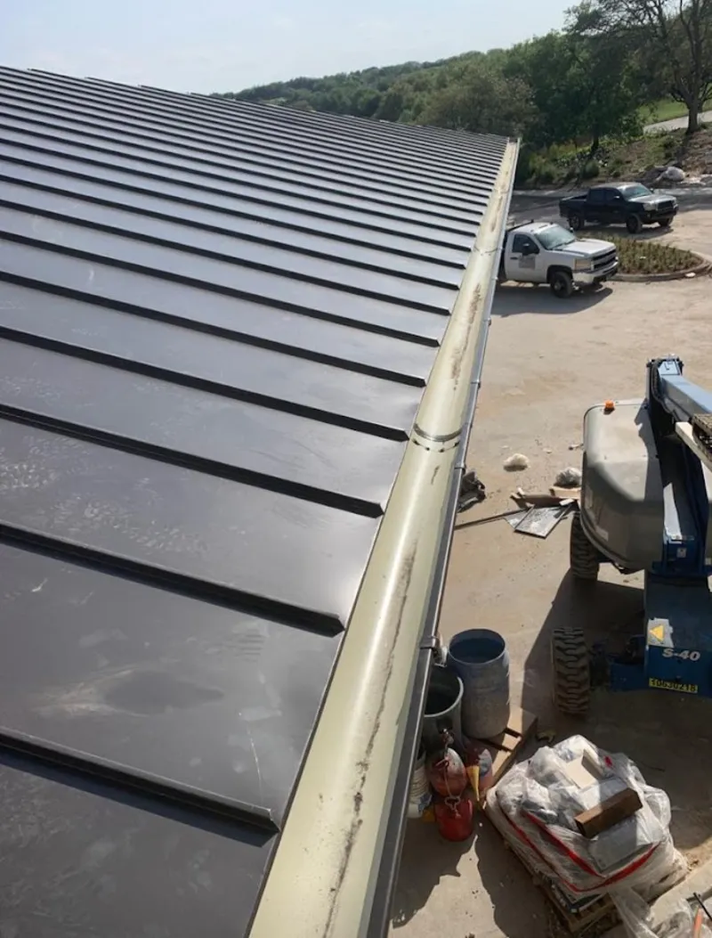 Standing seam panel and gutter detail on a metal roofing jobsite in Castro Valley